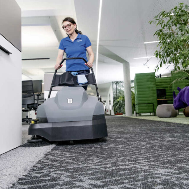 CVS 65/1 carpet vacuum sweeper sweeping an office carpet